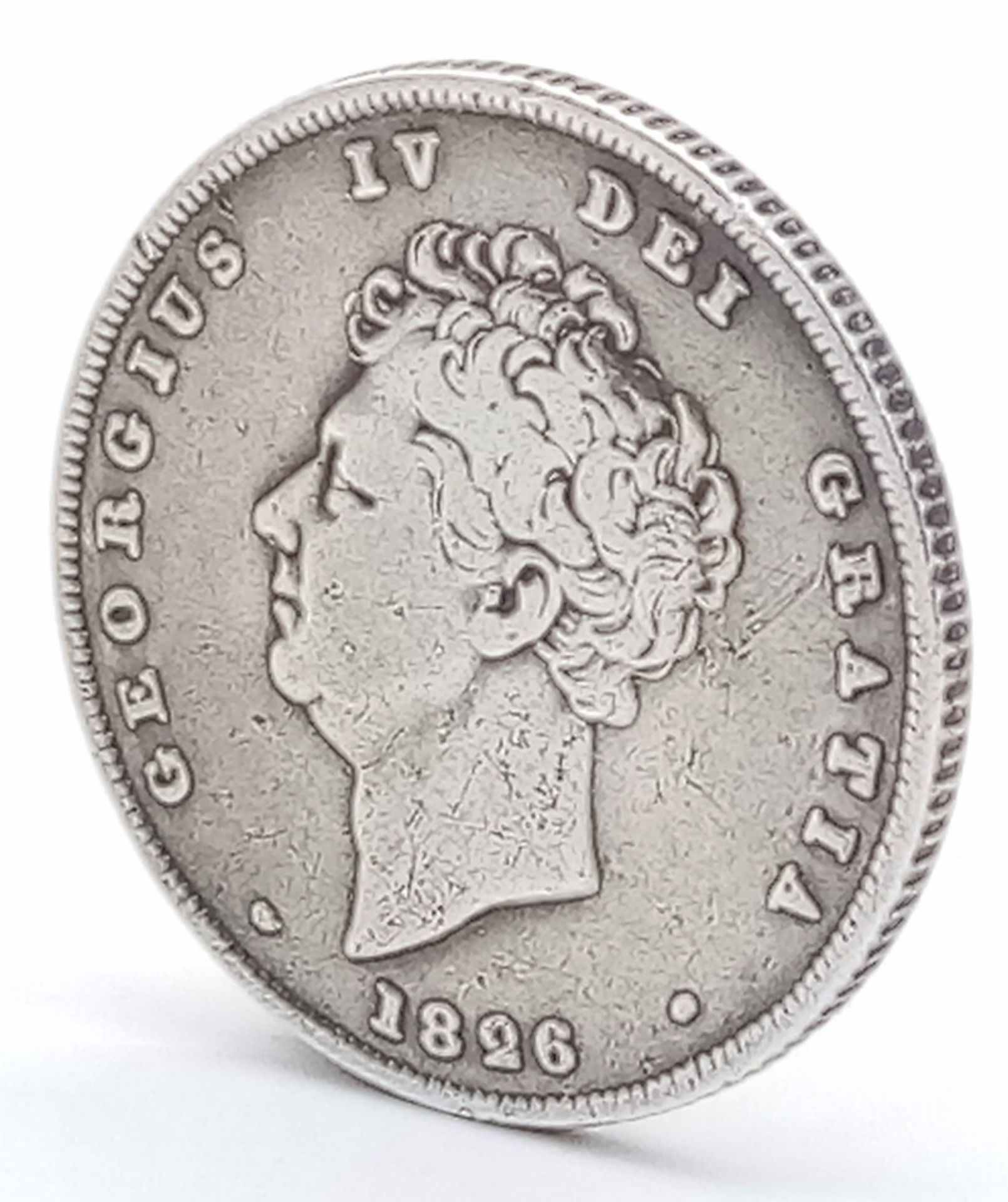 An 1816 George III British Silver Sixpence Coin. A decent grade but please see photos.