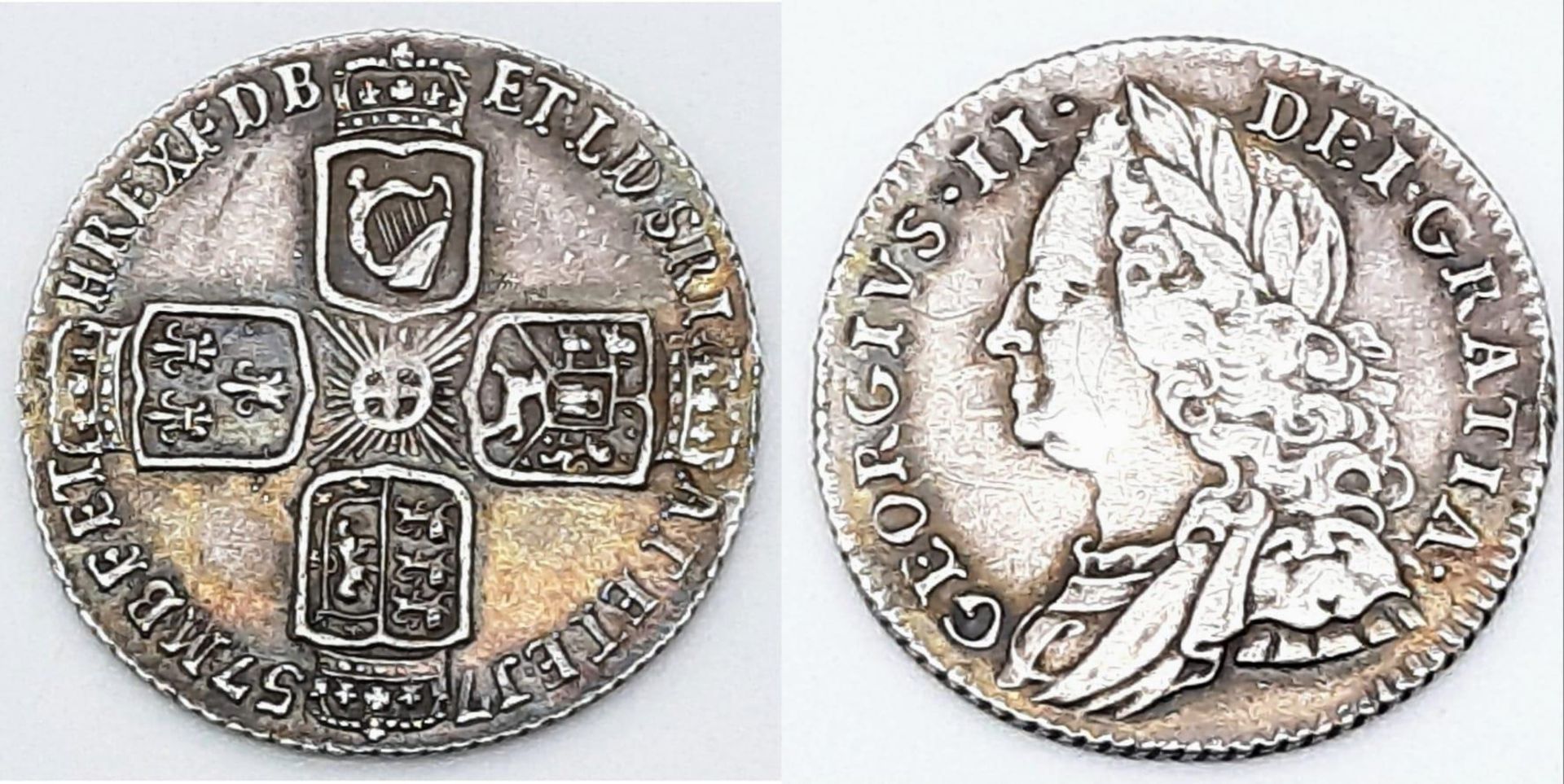 A George II 1757 British Silver Sixpence Coin. Please see photos for conditions.