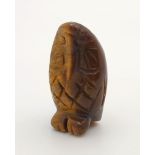 A HAND CARVED OWL FIGURE IN TIGERS EYE . 3cms approx