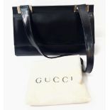 A Gucci Black Leather Shoulder Flap Bag. Zipped interior compartment. The interior has seen better