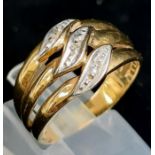 A 9K Yellow Gold Three Diamond Wave Ring. Size O. 4g total weight.