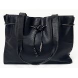 A Gucci Black Leather Small Tote Bag. Gucci monogram textile interior with zipped compartment.