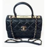 A Stylish Chanel Top-Plate Hand/Shoulder Flap Bag. Quilted soft black leather. Gold tone hardware