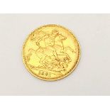 An 1891 Queen Victoria 22k Gold Full Sovereign Coin.