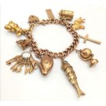 A Vintage 9K Charm Bracelet with Gold Clasp. Ten charms including: Swan, Bunny and Articulated Fish!