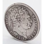 An 1817 George III Silver Sixpence Coin. Decent grade but please see photos.