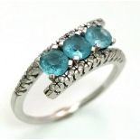 A BEAUTIFUL 18K WHITE GOLD DIAMOND & TOPAZ FANCY TWIST RING,, WEIGHT 3.5G SIZE N