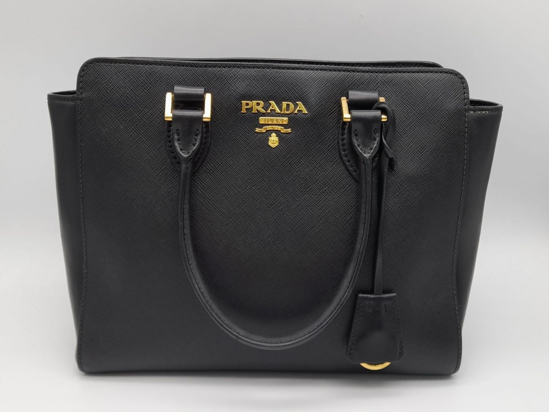 A Prada Black Leather Handbag with Adjustable Shoulder Strap. Textured leather with gold-tone - Bild 8 aus 8