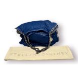 A Stella McCartney Falabella Electric Blue Tote Bag. Silver-tone chain shoulder straps. Magnetic