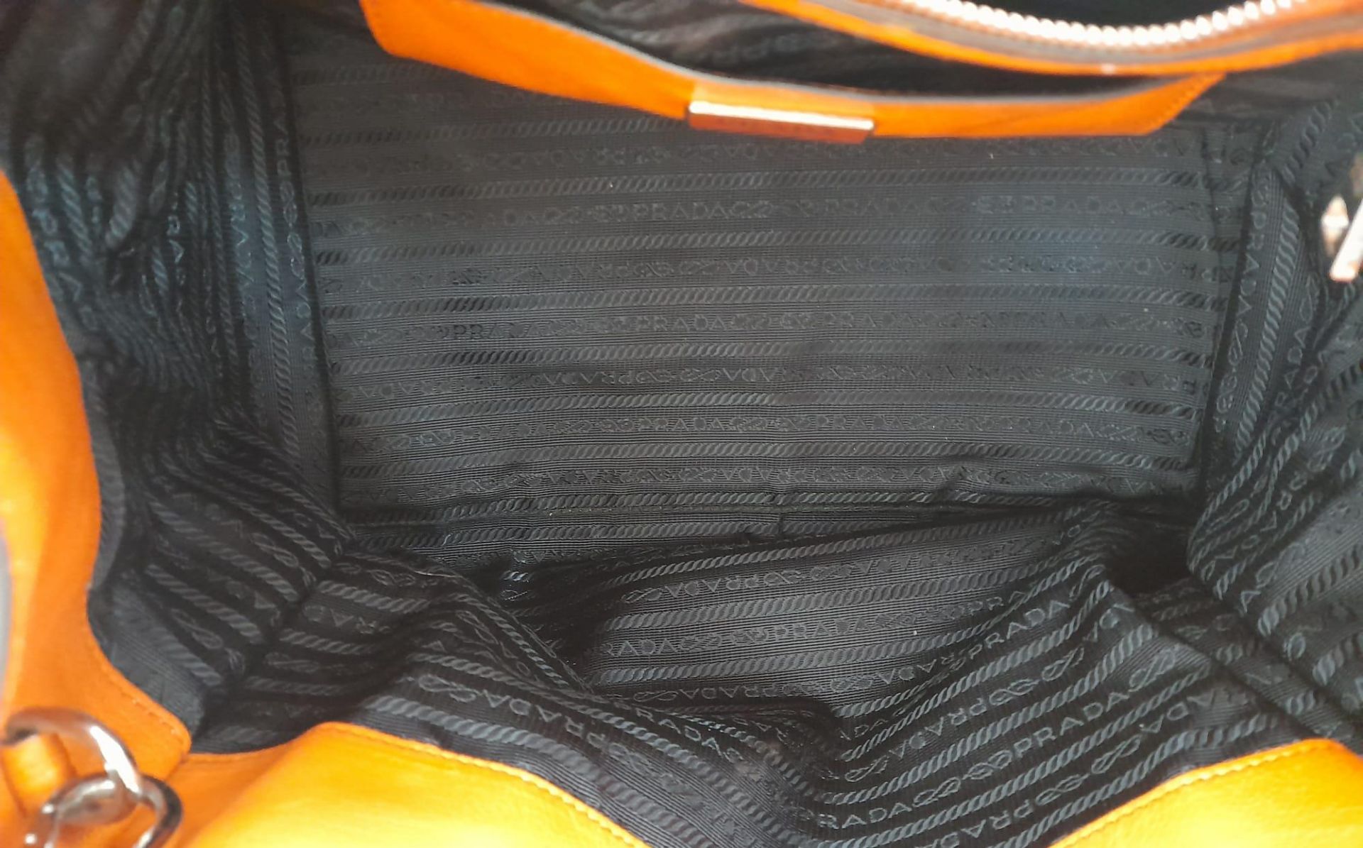 A Prada Saffiano Double Zip Luxury Tote Bag. Burnt orange leather with silver tone hardware. - Bild 15 aus 15
