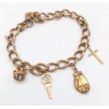 A Vintage 9K Yellow Gold Charm Bracelet with Heart Clasp. Four charms. 16.3g total weight.