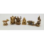 A collection of six brass Thai amulets.