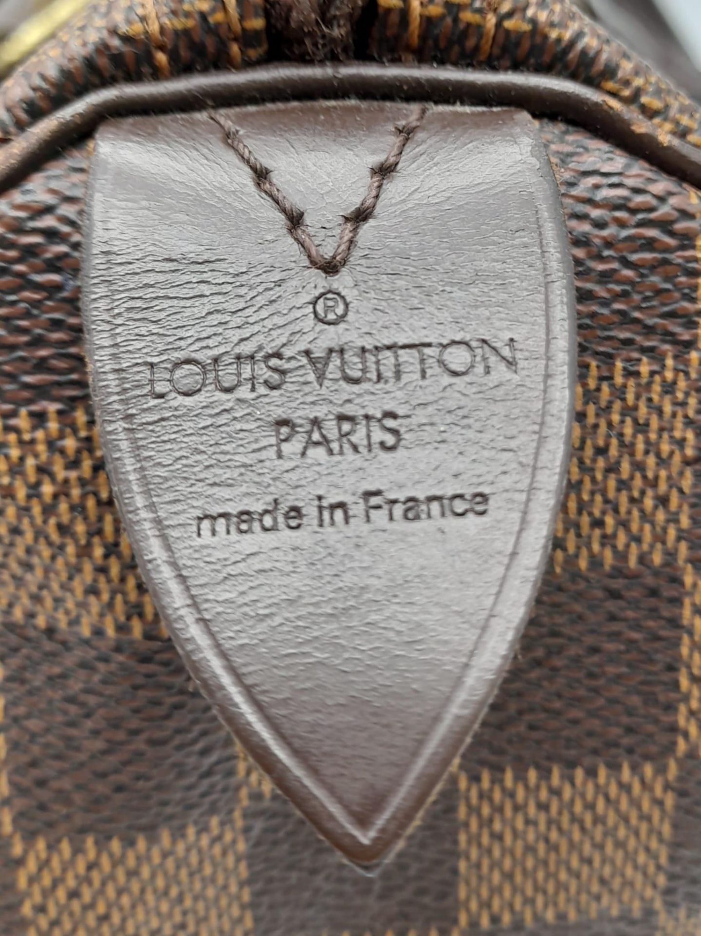 A Louis Vuitton Speedy Bag. LV canvas with brown leather trim and handles. Lock with keys. Red - Bild 7 aus 9