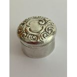 Antique SILVER PILL/SNUFF BOX in small circular form. Having Repousse Silver lid with scroll
