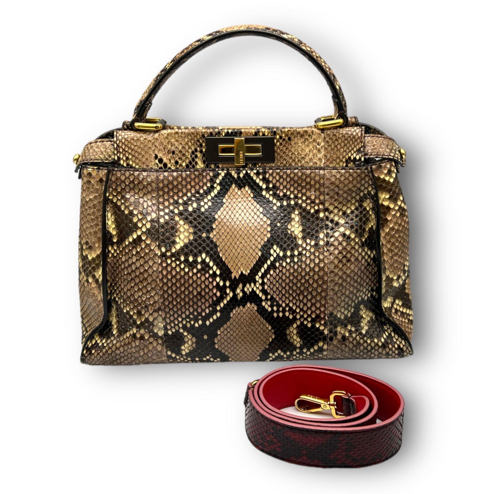 A Fendi Python Leather Hand/Shoulder bag. Attachable shoulder strap. Gold-tone hardware. Textile and