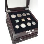 A Small Vintage Wooden Case with a Small Coin (8) and Stamp (3) Collection. Highlights include: 1908