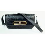 A Gossip Balenciaga BB Black Leather Handbag. Croc effect black leather. Gilded BB logo. Exterior