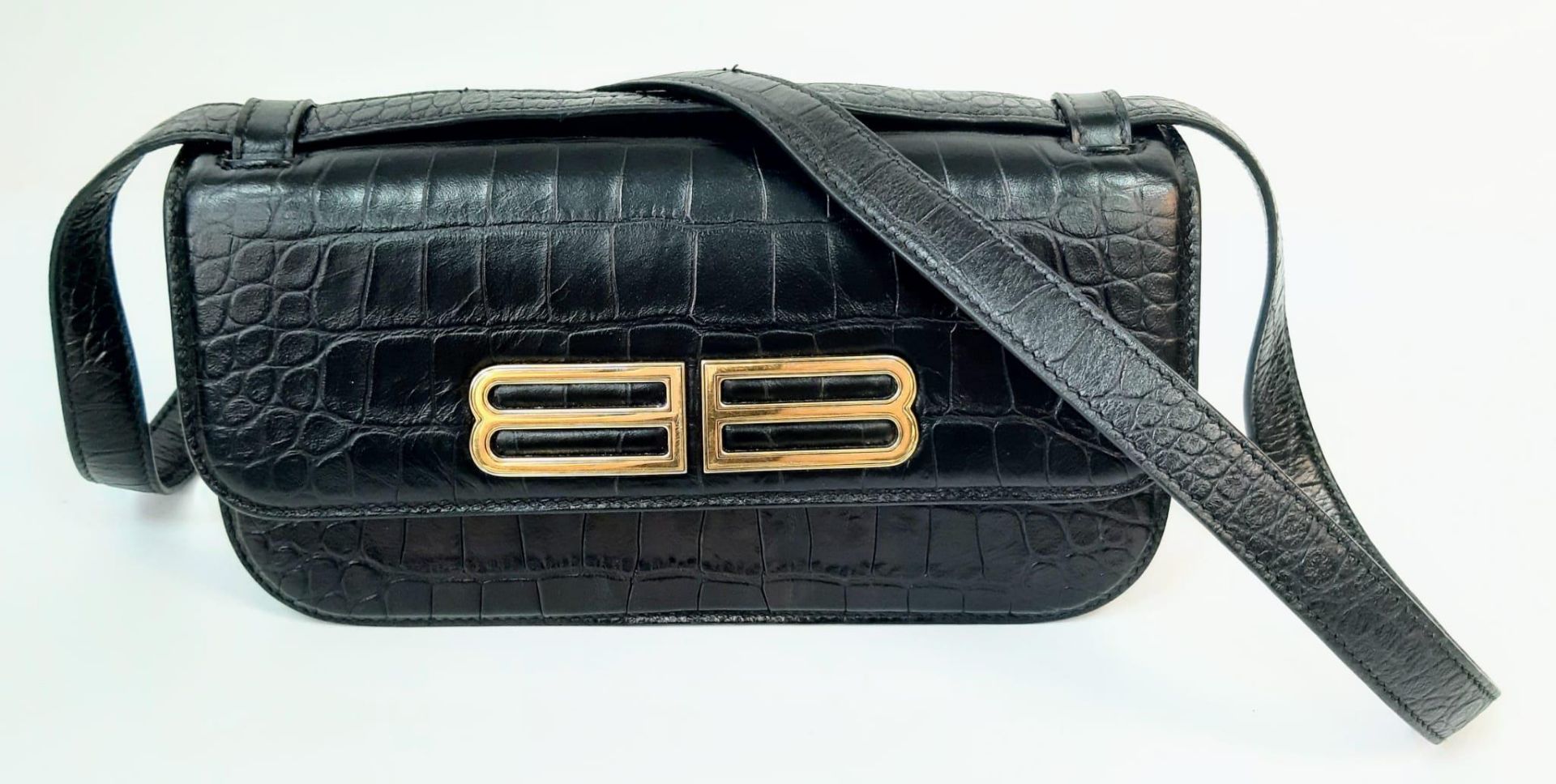 A Gossip Balenciaga BB Black Leather Handbag. Croc effect black leather. Gilded BB logo. Exterior