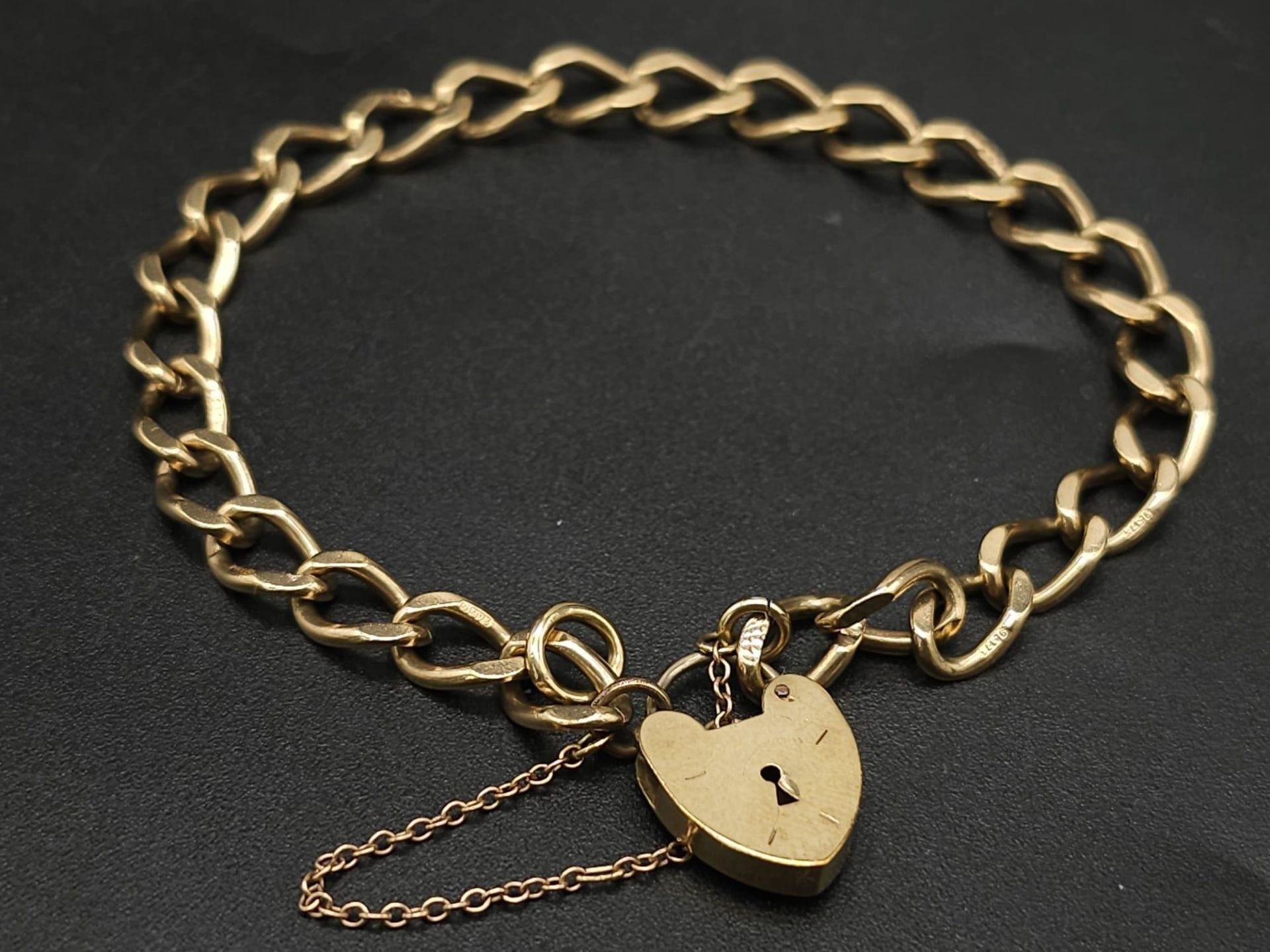 9K YELLOW GOLD CHARM BRACELET WITH PADLOCK CLASP AND SAFETY CHAIN, WEIGHT 11.5G