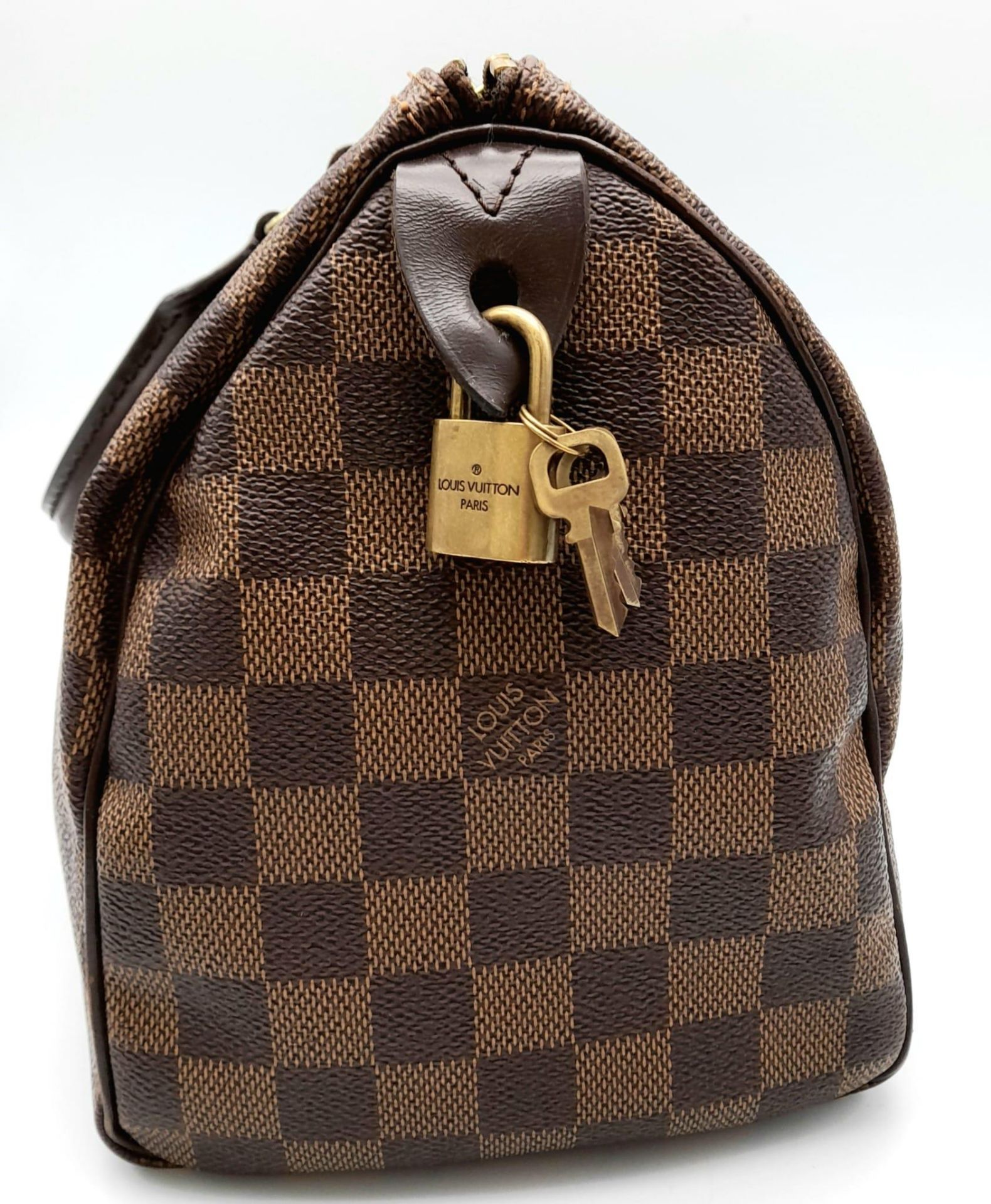 A Louis Vuitton Speedy Bag. LV canvas with brown leather trim and handles. Lock with keys. Red - Bild 4 aus 9