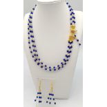 A very feminine, necklace and earrings set consisting of three rows of modern Sri Lankan round