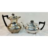 An Antique Walker and Hall Sterling Silver Tea and Coffee Pot. Made a year apart (1928 and 1929) but