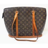 A Louis Vuitton Monogram Canvas Tote Bag. LV canvas exterior with brown leather trim and handles.