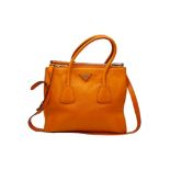 A Prada Saffiano Double Zip Luxury Tote Bag. Burnt orange leather with silver tone hardware.
