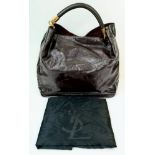 A YSL Patent Brown Leather Tote Bag. Textured brown leather exterior with gilded YSL logo handles.