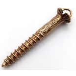 A 9K GOLD PENDANT OR CHARM IN THE SHAPE OF A SCREW . 4.4gms 3.5cms