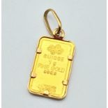 A GRAM OF FINE GOLD IN INGOT FORM (24CT) SET IN 9K GOLD . 1.62gms