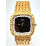 A "JAEGER LE COULTRE" 18K GOLD DRESS WATCH WITH BLACK DIAL , DIAMOND BEZEL , SOLID GOLD WOVWN