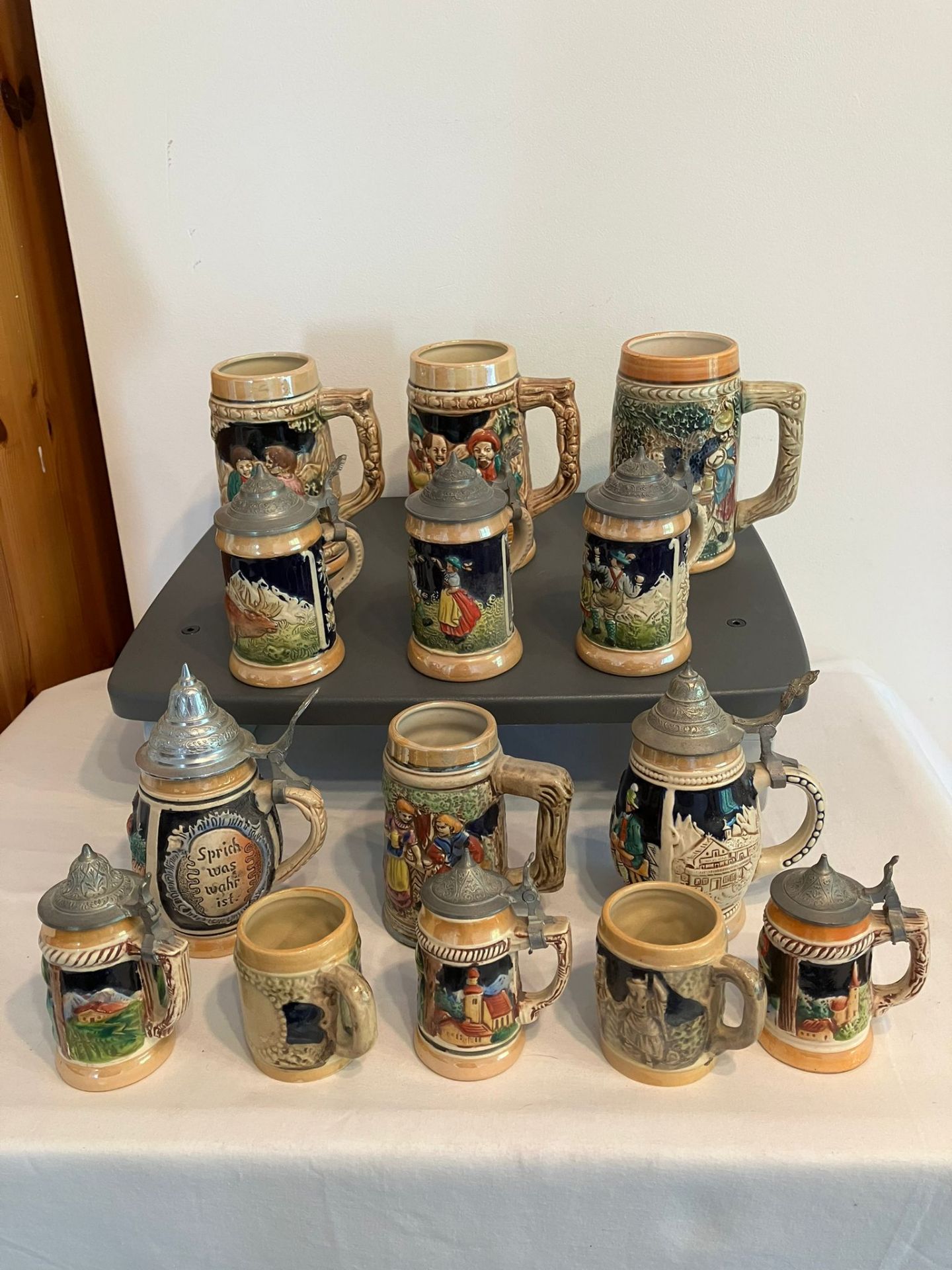 Collection of German/Austrian Beer Steins and Tankards. Various sizes to include steins with lids,