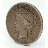A 1922 Silver one Dollar Coin. Please see photos for condition.