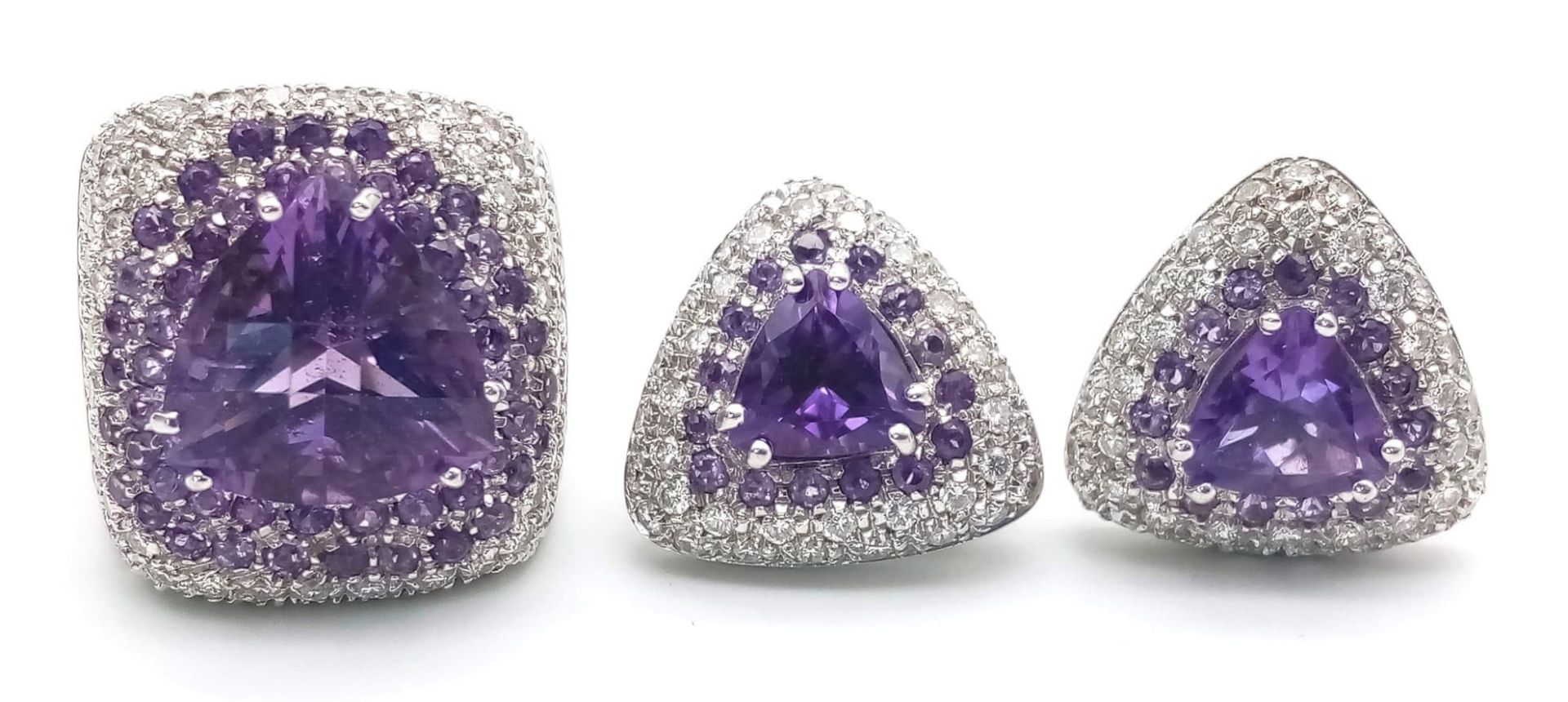 A FABULOUS 18K WHITE GOLD DIAMOND AND AMETHYST RING WITH MATCHING EARRINGS . 35.5gms