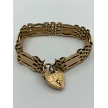 Vintage 9 carat ROSE GOLD GATE BRACELET with beautifully engraved heart padlock fastening. 13.84