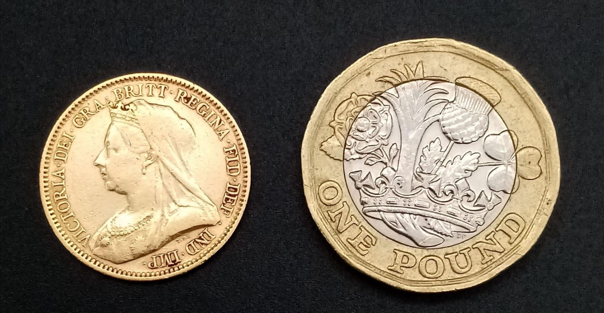An 1894 Queen Victoria 22K Gold Half Sovereign Coin. VF but please see photos. - Image 2 of 2