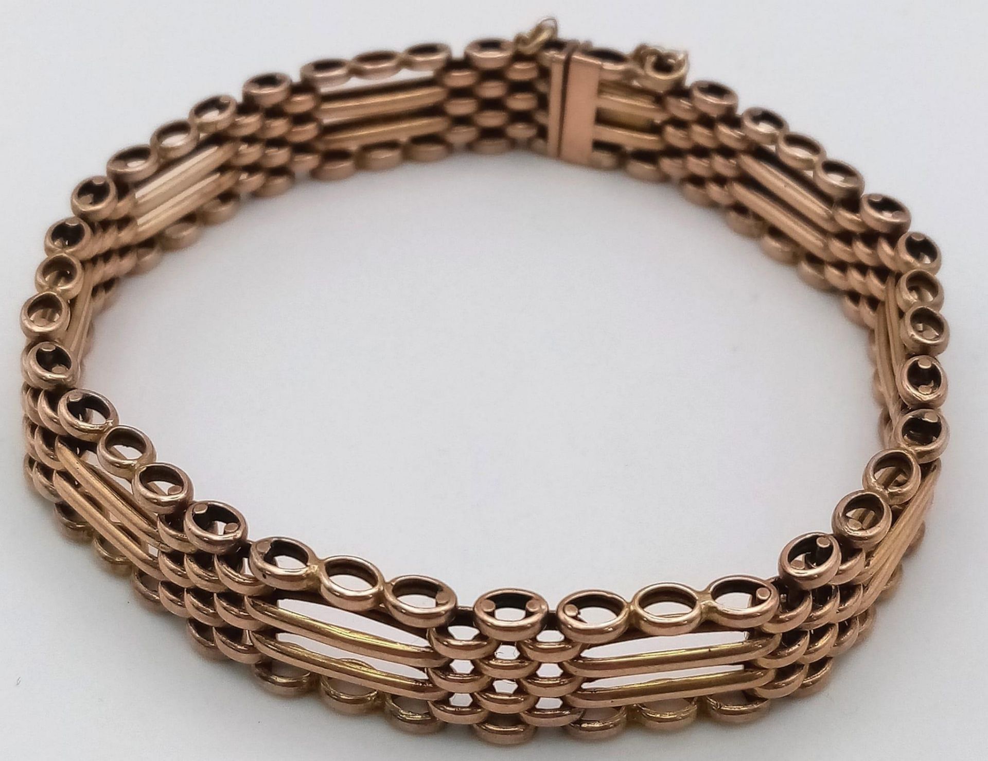 A FOUR ROW VINTAGE SEMI GATE BRACELET IN 9K ROSE GOLD WITH SAFETY CHAIN .17.1gms - Image 2 of 5