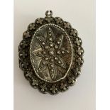 Antique VICTORIAN SILVER MOURNING LOCKET having raised decoration and detail to both sides. Clear