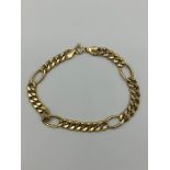 Beautiful 9 carat yellow GOLD BRACELET having curb chain links with occasional large link detail.