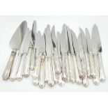 A Selection of 23 Sterling Silver Cutlery Knives. From the same Sheffield maker. Hallmarks on