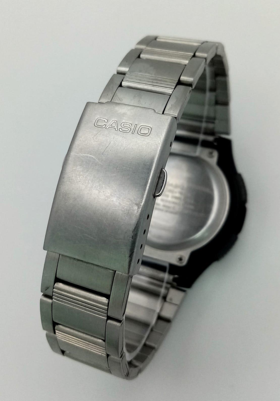 A Casio World Time Five Alarm Watch. Stainless steel strap and case - 45mm. Black dial with - Image 9 of 11