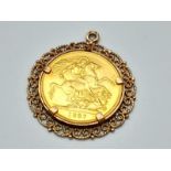 A 22K GOLD DOUBLE SOVEREIGN (15.9gms) DATED 1887 AND IN VERY NICE CONDITION SET IN 9K GOLD (5.2gms).