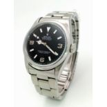A ROLEX OYSTER PERPETUAL "EXPLORER" IN STAINLESS STEEL WITH BLACK DIAL , GOOD CONDITION . 36mm