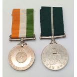 Two iconic medals commemorating the granting of independence to India in 1947 and the partition of