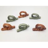 A vintage set of six ceramic napkin rings in the form of twisted bamboo. 3× green, 3× brown.