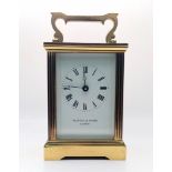 A Vintage Mappin and Webb Carriage Clock. In working order with key. 11cm tall.