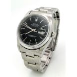 A Rolex Oyster Perpetual Datejust Gents Watch. Stainless steel strap and case - 36mm. Black dial