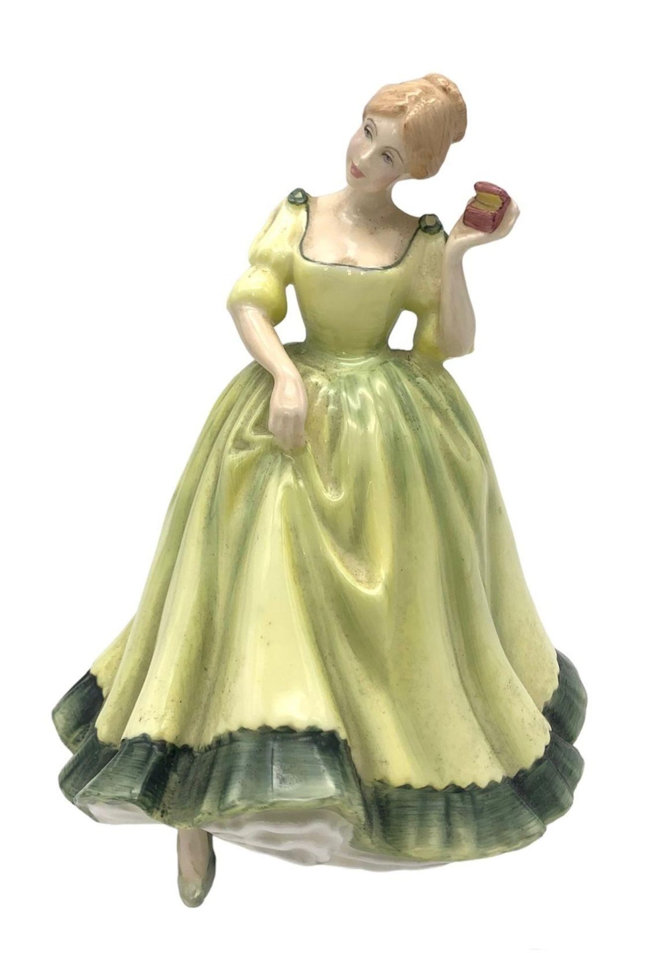 A Royal Doulton 1979 Paula Figurine. This is the Limited Edition Lady in Green Dress Holding the Red