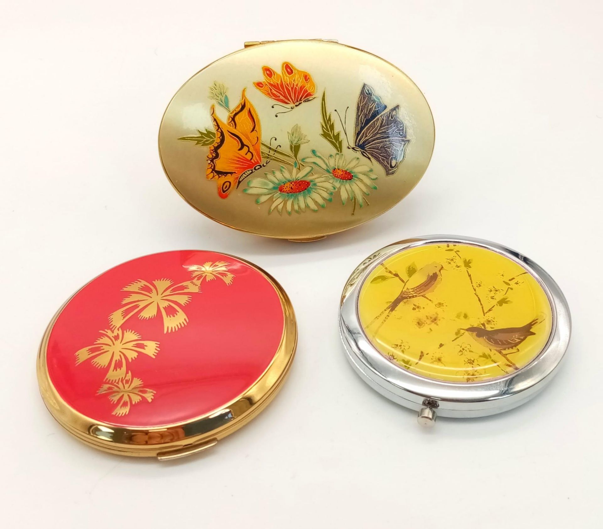 Three Vintage Compacts. Floral and wildlife decoration. All in good condition. One compact is a